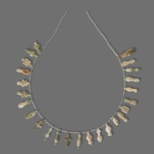 Fragment of a necklace of amulets 26 pieces, Goluchów Greater Poland Voivodeship, necklaces, grave