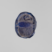 Scarab with a ram's head, ram's head ornament, sacred animal protective amulet in navy blue glass;