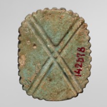 Amulet — plaque with the head of the god Bes; maker, found in Goluchów Greater Poland Voivodeship;