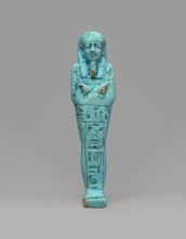 Ushabti Wahibre-em-achet. Mummy-shaped funerary figurine shabti made of blue faience with black
