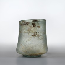 Mug with walls widely flared at the bottom above the ring-shaped foot, slightly convex and forming