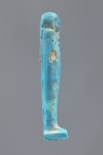 Ushabti, Mummy-shaped figurine made as grave goods, standing on a base with the back supported by a