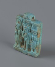 Amulet – plaque with a triad of deities: Harpocrates Horus, Isis, Nephthys. Amulet in the shape of