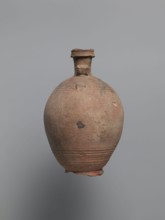 Bottle, unknown Egyptian workshop. Bottle with a rounded and falling rim, concavely profiled.