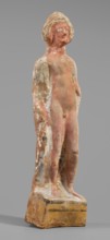 Male figurine, unknown Boeotian workshop. Standing man on a high quadrangular base, arched at the