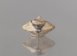 Oil lamp, unknown Palestinian workshop. Islamic art, Arabic culture. Oval lamp with conical handle.