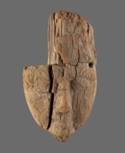 Sarcophagus mask with part of a wig preserved over the central and left part of the face and a
