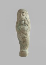 Ushabti, carelessly made figurine with schematic facial features, in a narrow wig revealing the