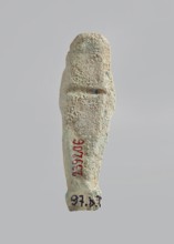 Ushabti. Carelessly made figurine with schematic facial features, in a narrow wig revealing the
