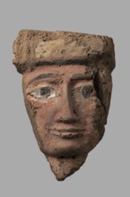 Sarcophagus mask with a partially preserved fragment of a wig above the forehead painted yellow