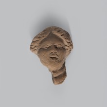 Head of a terracotta female figurine with part of the neck and a fragment of a robe preserved.
