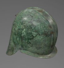 Bronze helmet with rectilinear cutouts for the eyes, nose, mouth, and chin; the helmet has two