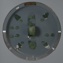 Hoplite shield, 6th century BC, Italy, weaponry, A round display with a muted gray background holds