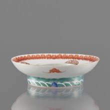 Bowl stand. Porcelain shard in the form of a ring with white glaze. Decoration painted with