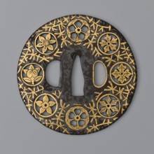 Round tsuba maru gata of the mon-sukashi type, decorated with eight openwork coats of arms monami