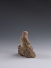 Luohan on a lion;, arhat iconography; lion iconography; figurine; Chinese art; Qing dynasty