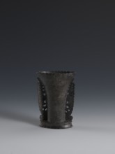 Vase, made of dark soapstone with bas-relief and openwork in places; plant ornament. One of three.
