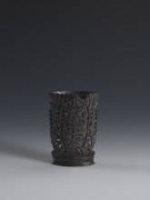 Vase, flattened vase made of dark soapstone with bas-relief and openwork in places, engraved. One