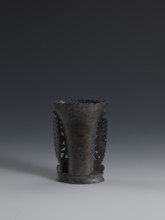Vase, flattened vase made of dark soapstone with bas-relief and openwork in places, engraved. One