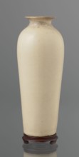 Cylindrical porcelain vase tapering toward the bottom with a flat rim; light cream glaze with fine