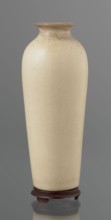 Cylindrical porcelain vase tapering toward the bottom with a flat rim; light cream glaze with fine