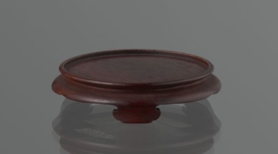 Vase on saucer. Cylindrical porcelain vase tapering toward the bottom with a flat rim; light cream