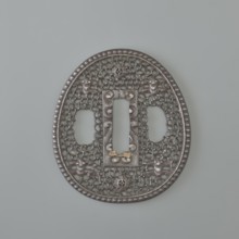 Crossguard tsuba, sword crossguard in namban style; openwork, egg-shaped tsuba with a separated