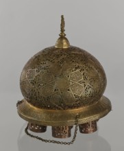 Lamp, Islamic art, Arabic culture; metal oil lamp with Arabic inscriptions and geometric ornament.