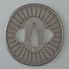 Crossguard tsuba, Tsunetada,  craftsman; decorated with an openwork positive design of thirty-two