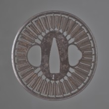 Crossguard tsuba, Tsunetada maker; decorated with an openwork positive motif of thirty-two