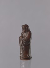 Daruma, Japanese, Meiji period 1868–1912. Ceramic figurine of Daruma Buddhist monk, male figure in