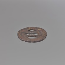 Crossguard tsuba, Kaneie,  school craftsman author. Oval tsuba for a short tantô sword, with an