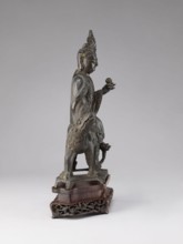Buddhist deity on a buffalo on a base; figurine; Chinese; Chinese Buddhism; lotus iconography; Qing