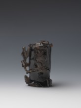 Vase on base, carved ornaments, flowers, birds decorative motifs, stylized rocks; wooden base, oval
