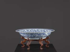 Platter on stand, Blue-and-white porcelain platter on a low foot with a wide rim, sitting on a