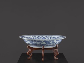 Platter on stand, Blue-and-white porcelain platter on a low foot with a wide rim, seated on a