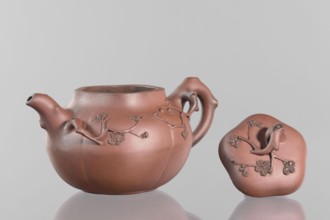 Teapot with a peach-shaped lid;, Red stoneware teapot, Yixing style; handle and spout shaped like