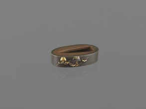 Sword hilt cap kashira, Melee weapon hilt cap decorated with two flowerpots: one with a dwarf pine