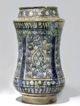 Albarello, 14th century Iran, Persian, Islamic art. Ceramic albarello vessel with floral/plant