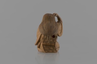Netsuke in the shape of a nô theater actor wearing an Okame mask, Hôjitsu fl. ca. 1800–1860
