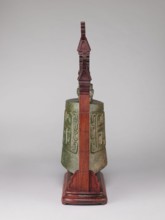 Bell on a wooden stand in the shape of a paifang gate, gilded mount for hanging the bell. Bronze