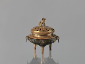 Incense burner koro of the ding type with a cover. Incense burner with two handles knobs, on three