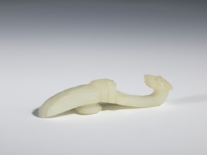 Belt clasp, Chinese, Qing dynasty 1644–1911, 18th–19th century. Milky-white translucent jade.