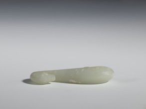 Belt clasp, Chinese, Qing 1644–1911, 17th–18th century. Milky-white slightly translucent jadeite,