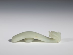 Belt clasp, stones, Milky-white jade with colloid clusters. Full-plastic carved head. Chinese, Qing