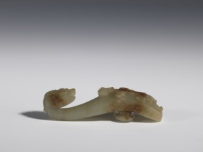Belt clasp, Chinese, Qing 1644–1911, 17th–19th century. Jadeite with traces of chalcedony. Handle