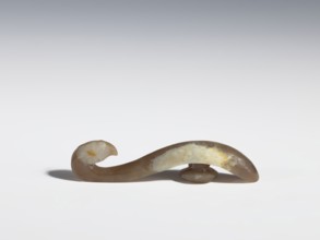 Belt clasp, purchase provenance; Chinese; Qing 1644–1911; brown jade with lighter spots;