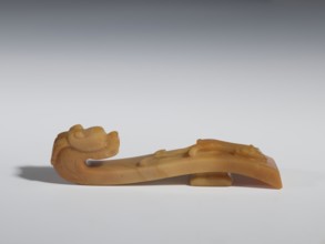 Belt clasp, Chinese; Qing 1644–1911; 18th–19th century. Materials and technique: brown chalcedony;