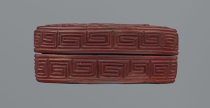Box with lid; Chinese; red lacquer carved with meander leiwen, cloud and Buddhist ornament; reeds