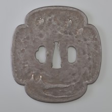 Crossguard tsuba, Kaneie, signed. Quatrefoil shape mokkô gata with a slightly raised edge of the